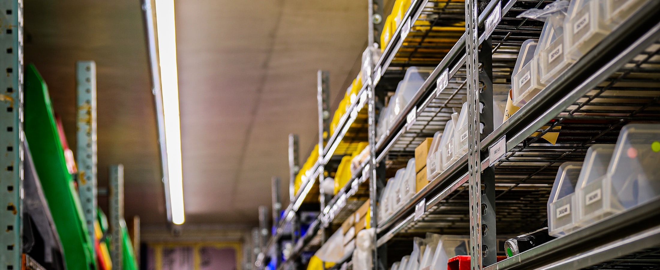 Shelving racked with spare parts bins in a workshop store